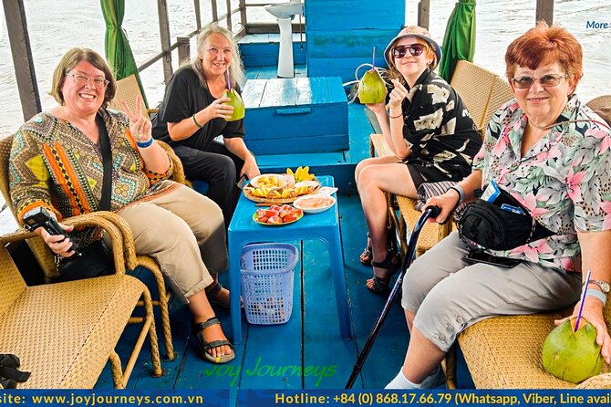 Authentic 'Less-Touristy' Mekong Delta Ben Tre 1-Day Tour - Entering the Day by Boat: Fresh Fruit and River Views