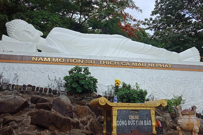 Black Virgin Mountain, Cao Dai Temple & Ben Duoc Cu Chi Tunnel - Tay Ninh lunch with water, a first drink, and local flavor
