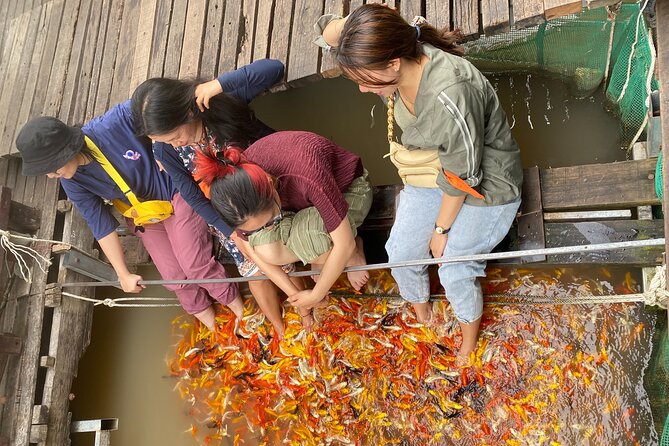 Can Tho day tour: fruit garden&floating fish farm in Son islet - Fish Farming at Golden Hour: Ponds, Floating Cages, and Sunset Views