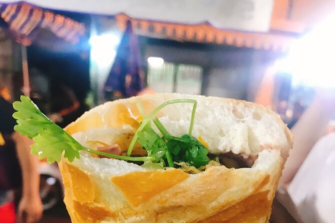 Ho Chi Minh City Signature Local Street Food by scooter Tour - Stop 1 in the city: your first taste starts fast