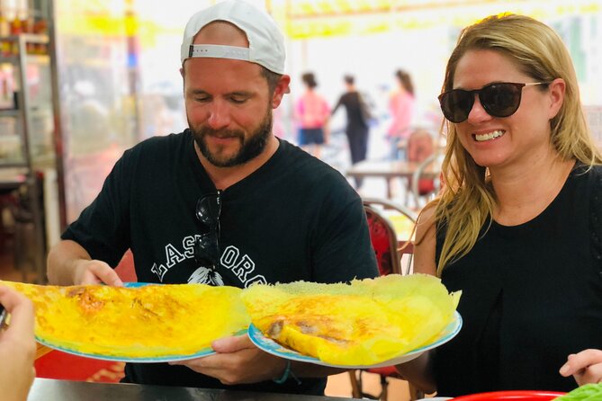 Ho Chi Minh City Street Food Tour & Sightseeing By Motorbike - Nguyễn Thiện Thuật apartments and Bánh Khọt, where crispy turns into culture