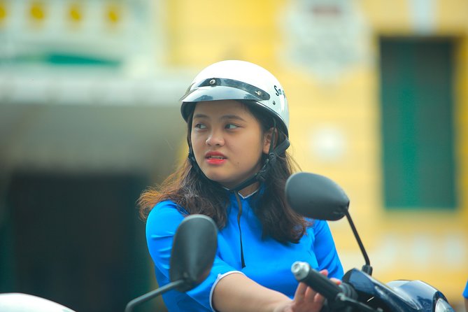 Ho Chi Minh City Tour by Motorbike with Female Riders | KissTour - Getting ready for the ride: safety gear, scooter comfort, and traffic reality