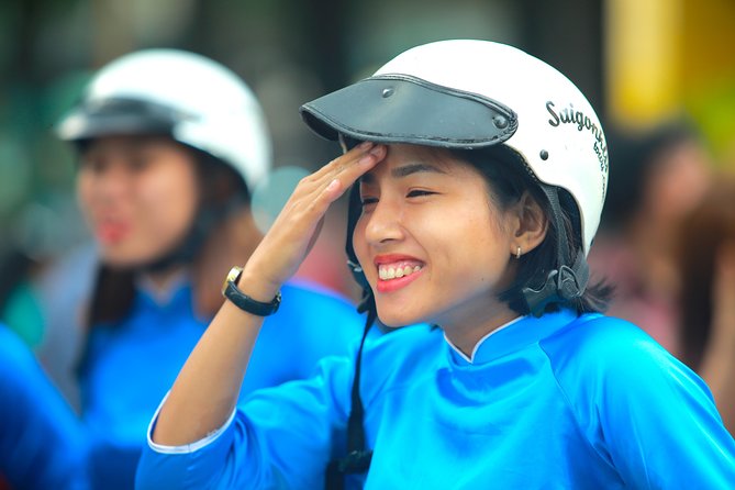 Ho Chi Minh City Tour by Motorbike with Female Riders | KissTour - Independence Palace pass-by: a fast look that still adds context