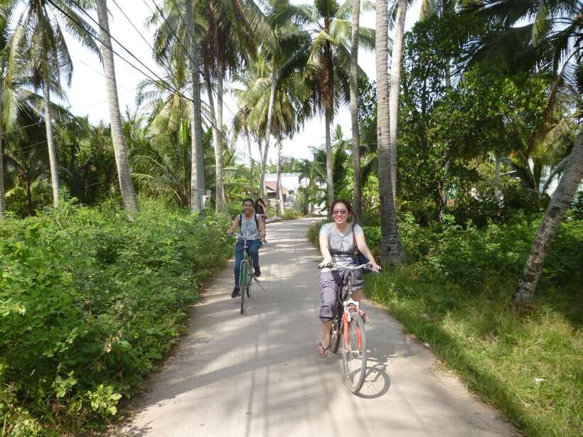 Mekong Day Tour by Car:Cai Be market, Local Island & Cycling - Village paths and optional cycling, paced to your comfort