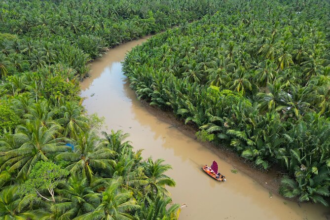 Mekong River Relaxing Sail boat cruise to Coconut Canals (1.5HRS) - Sunset from a coconut tree, plus fried banana snack breaks