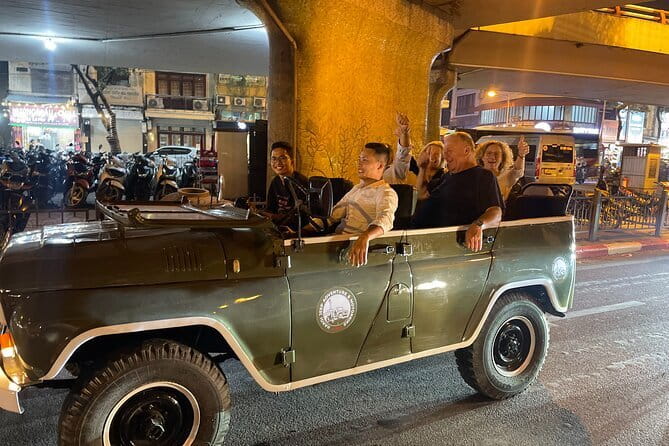 Saigon By Night Open Air Jeep Street Food Tour Experience - A moving seat with a wide view of Saigon after dark