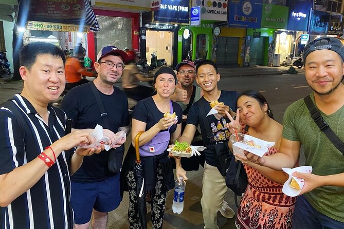 Saigon by Night: Private Street Food Walk You Can’t Miss - The finale: coconut ice cream, crossing to other districts, and the flower market