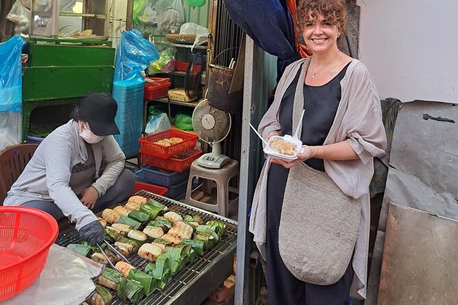 Saigon Food Tour by Scooter with Eleven Tastings - Ho Thi Ky Flower Market stop: grilled Vietnamese pizza, stuffed snails, and rice paper crunch