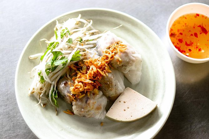 Saigon Night Street Food and City Tour on Scooter - Stop 3: noodle soups like bun bo Hue and banh canh