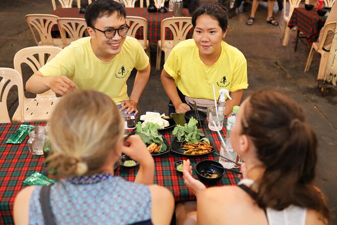 Saigon Night Street Food and City Tour on Scooter - Stop 4 BBQ time: street grilling and beer on the mini oven