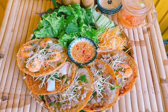 Saigon Scooter Adventure - City Sights & Street Food Tour - Ban Co Market and Nguyen Thien Thuat apartments: everyday Saigon life by scooter