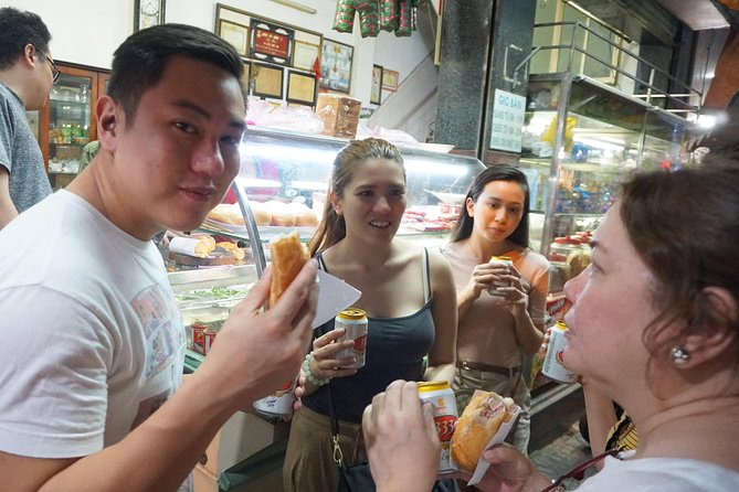 Taste the Unreal Street Food Walking Tour in Saigon - Mini city tour moments: ask the guide and you’ll get the story behind the bites