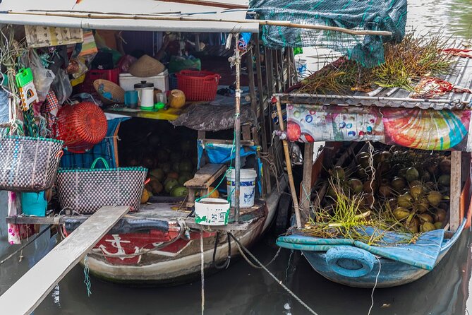 The River's Edge Photo Tour - Stop in District 7 by canal: tugboats, coconuts, and working river life